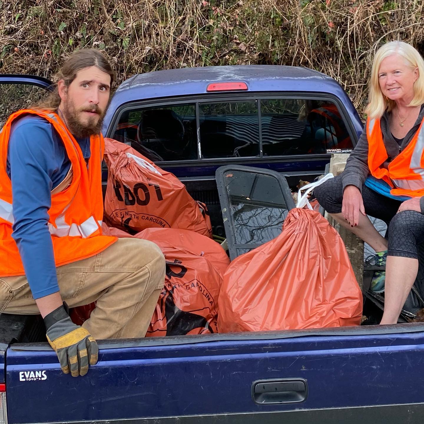 Volunteers in a swain river cleanup event.