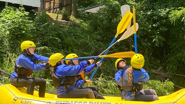 girls kayak camp teamwork north carolina